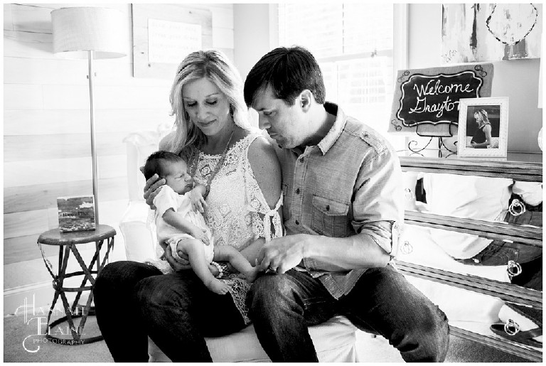 black and white photo of family with newborn 