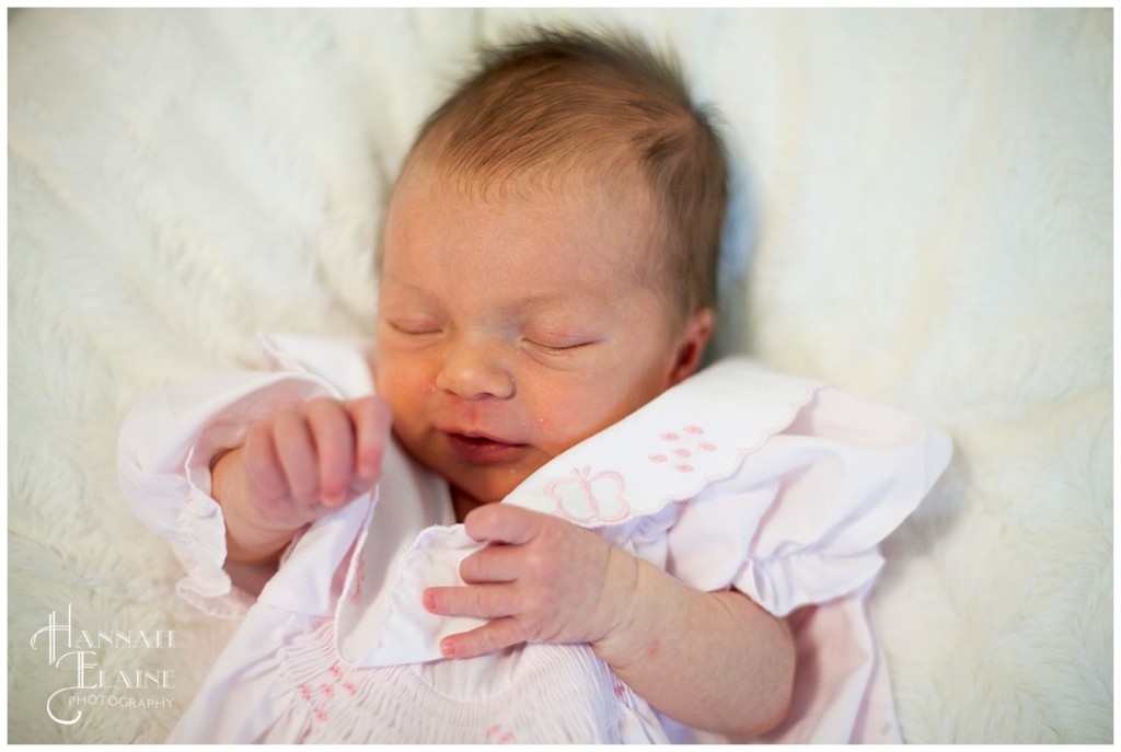 baby sleeps on fuzzy white blanket