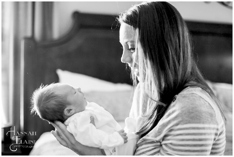 black and white image of mom gazing lovingly at her baby girl