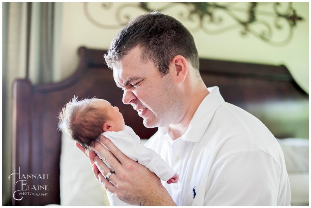 dad mimics his baby's unhappy face