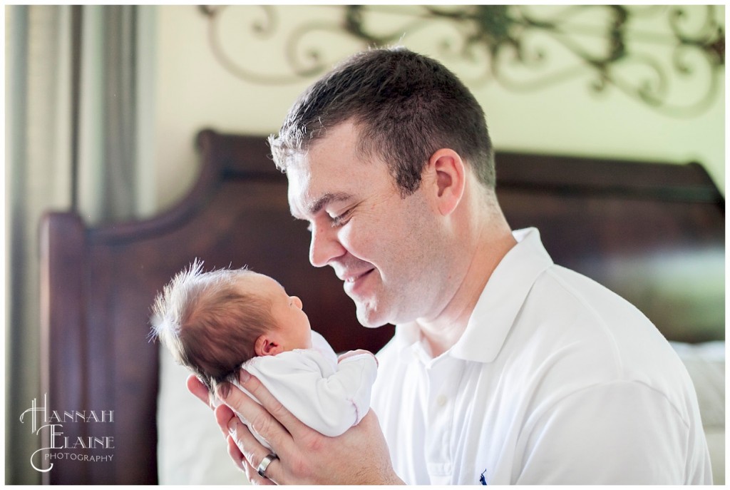 daddy smiles at his baby girl