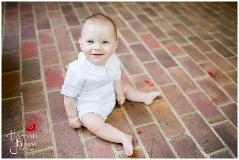 6 month picture on a brick pathway