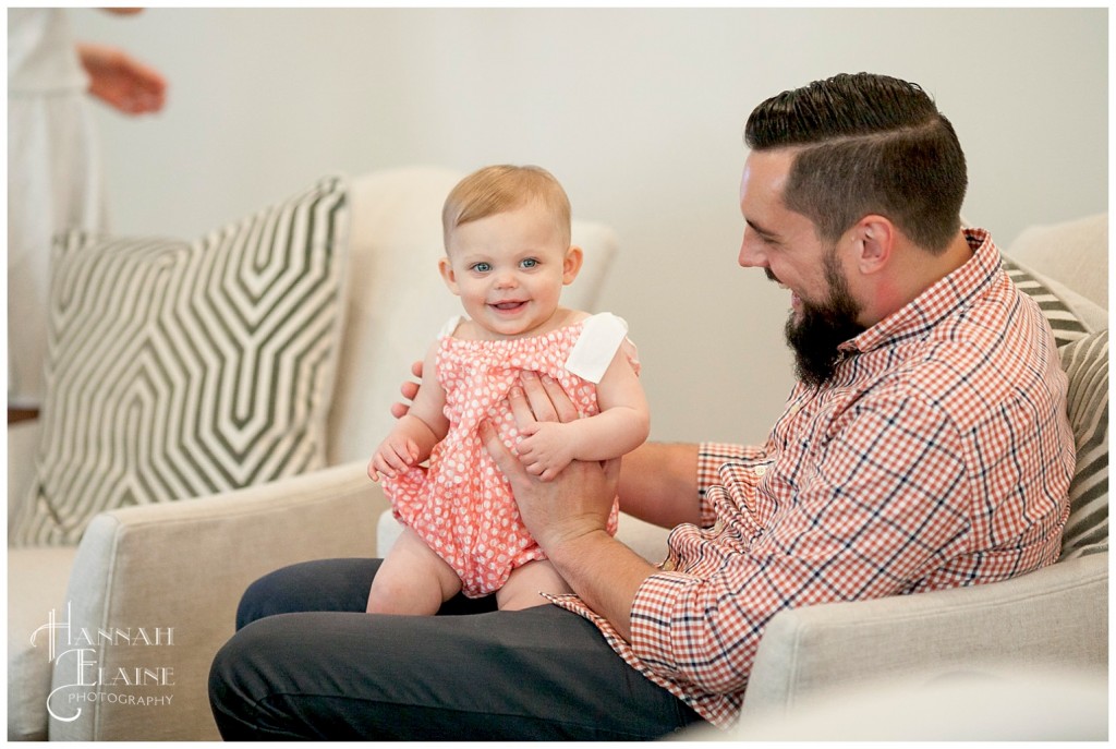 little girl sits on uncle's lap