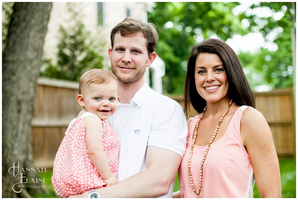 family in neutral tones pose for portrait