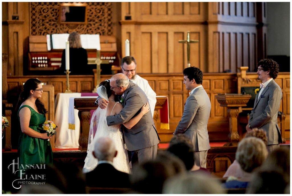 father of the bride gives his daughter away