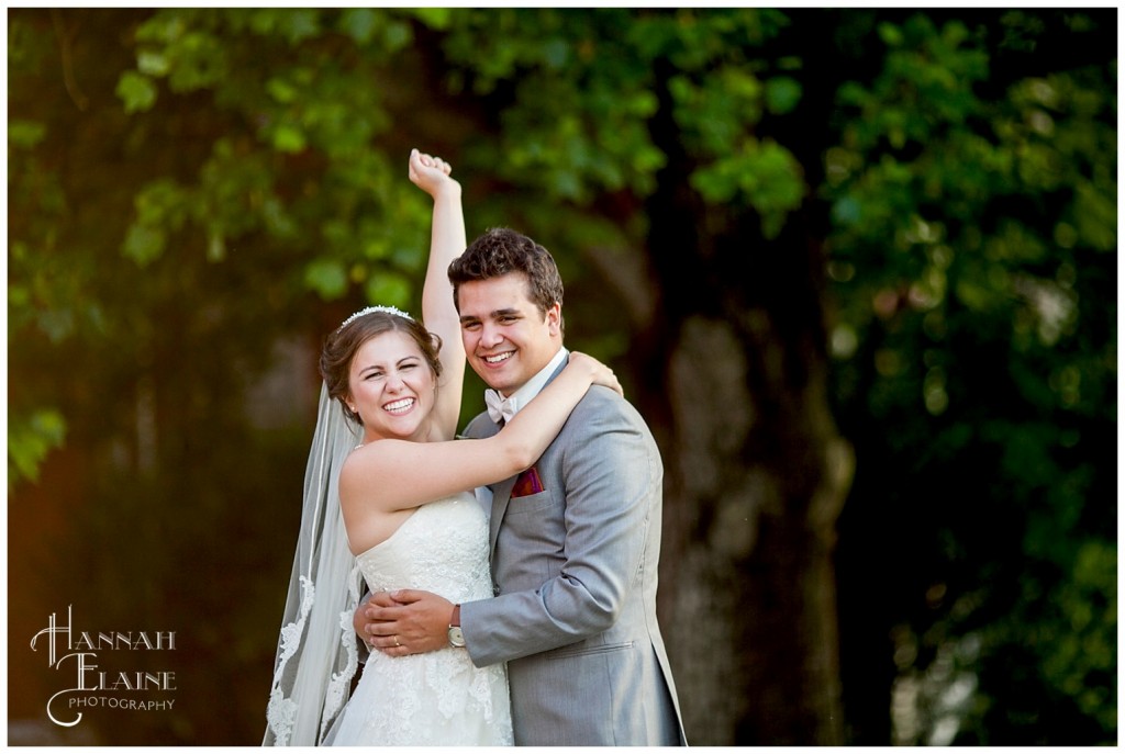 bride rejoices as she embraces her new husband