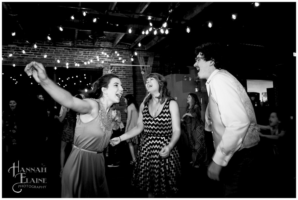 wedding guests sing and dance