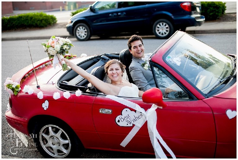 hannah and drew leave the wedding in a small red convertible