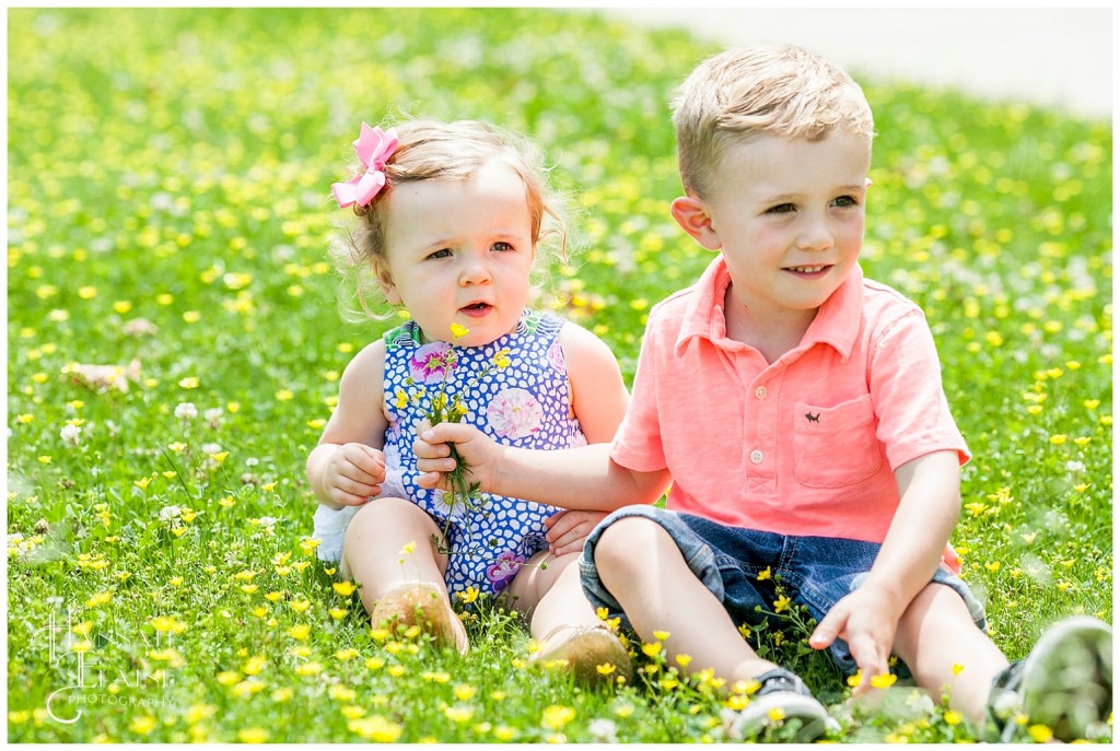 big brother gives his little sis some wild flowers