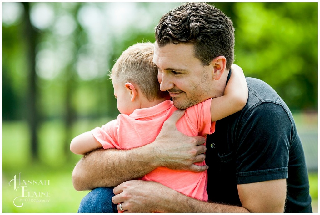 little boy hugs his daddy