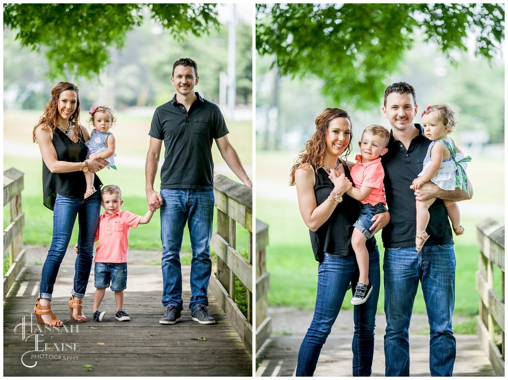 mom, dad, brother and sister stand together on a bridge