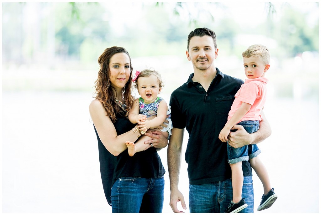 family photo in front of the pond at shelby