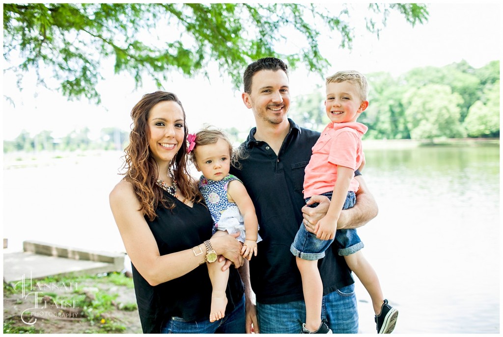 family stands by the pond at shelby park