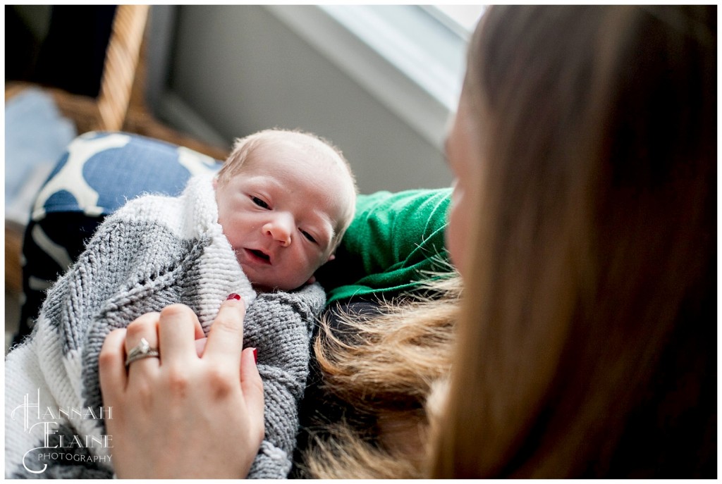 baby boy in his mother's arms