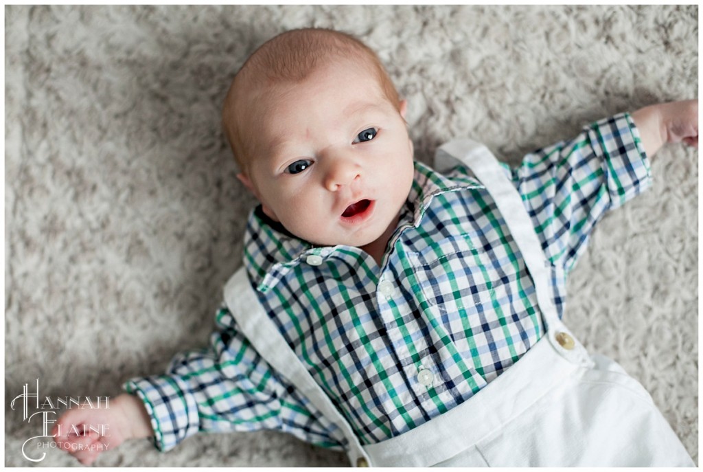 baby on the rug says cheese