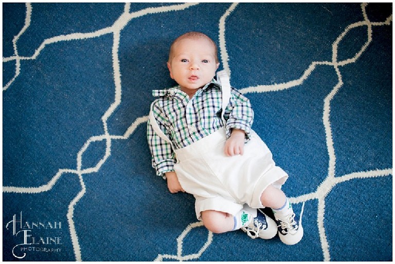 newborn on blue geometric rug 