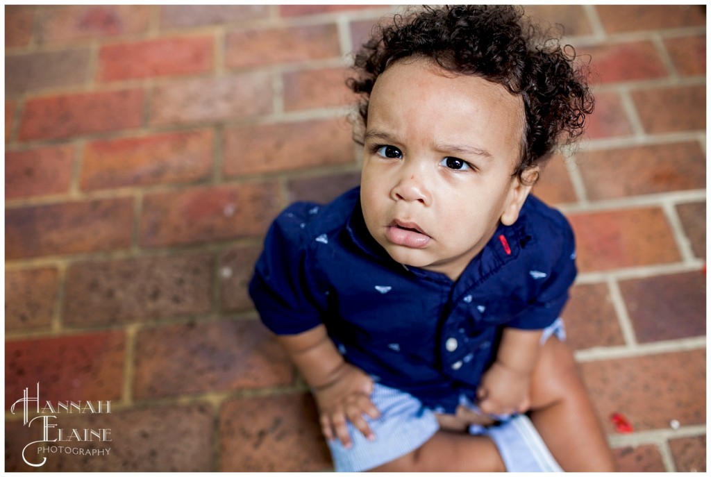 red brick backdrop for closeup of cute little boy