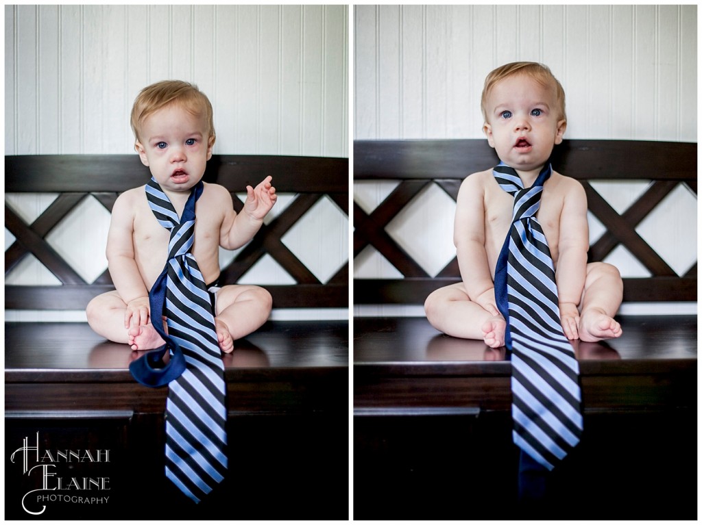 one year old boy wearing his dad's blue striped tie