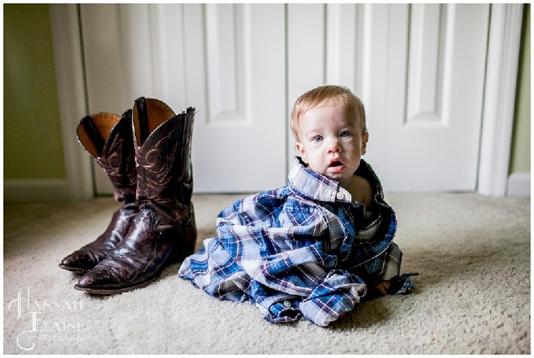 baby son photo with his dad's cowboy boots