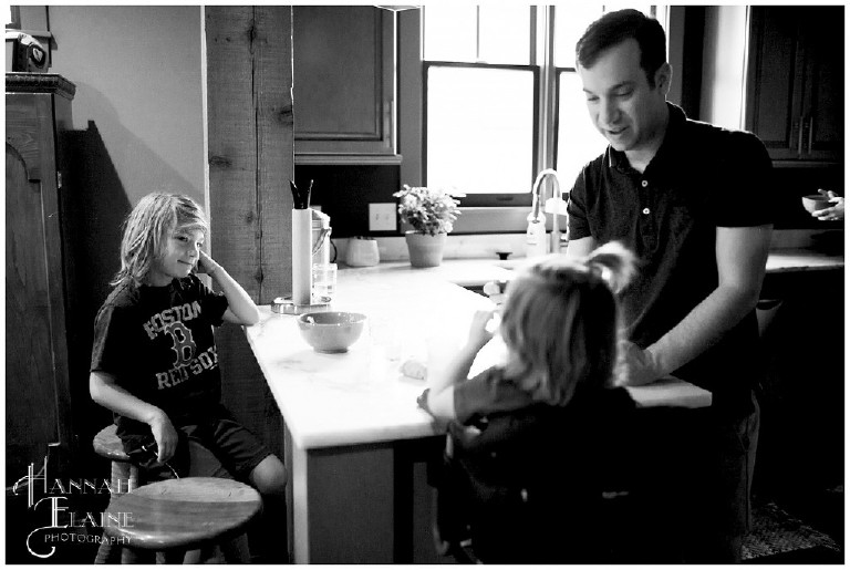 black and white photo of family eating breakfast