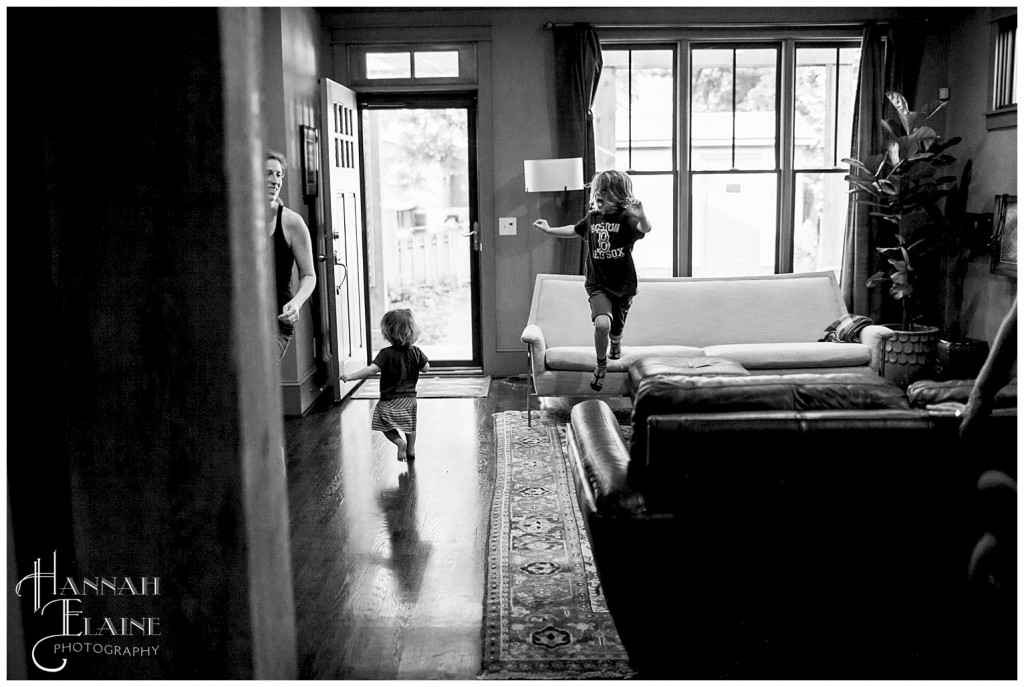 family jumping around in the living room