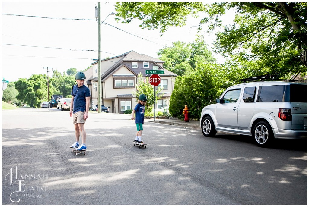 dad and son skateboard down the street in 12 south