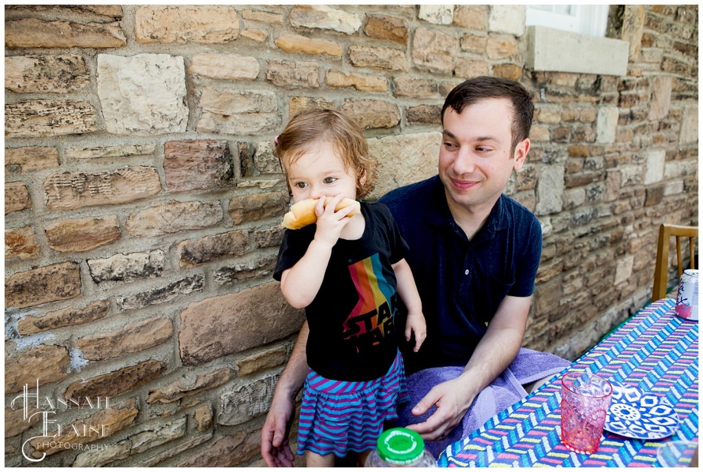 eating a bagel with cream cheese on the back porch