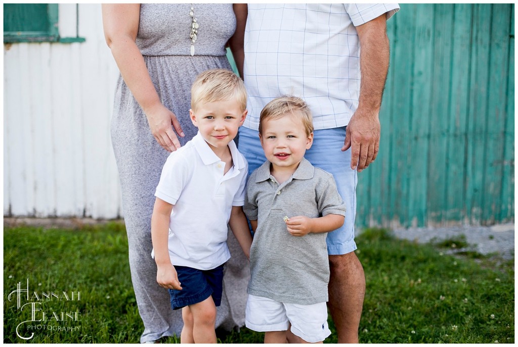 close up of brothers standing in front of mom and dad