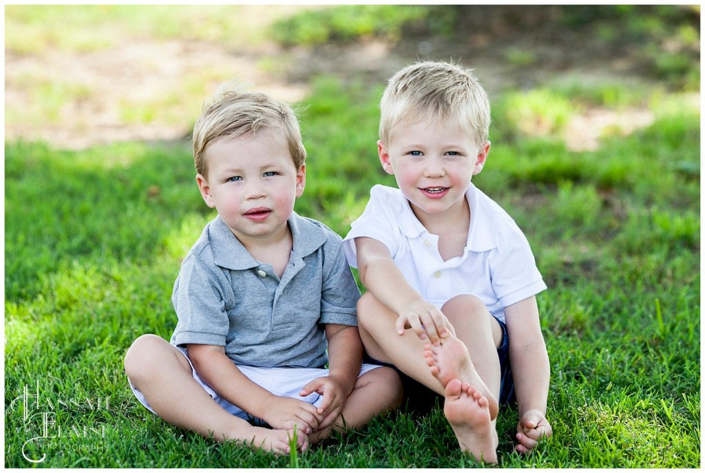 graham and lucas sitting in the grass