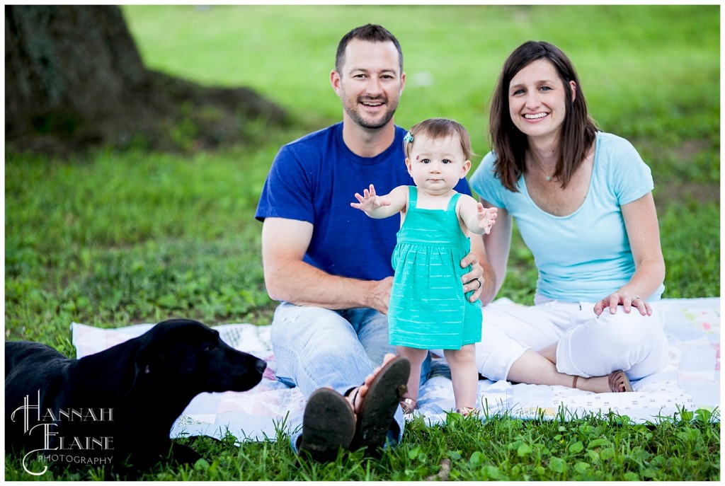 dog sneaks into the family photo in the park