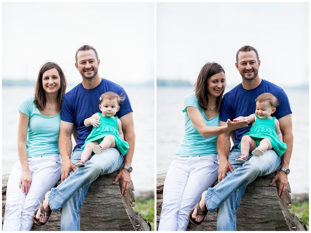 family sits on a log by the lake