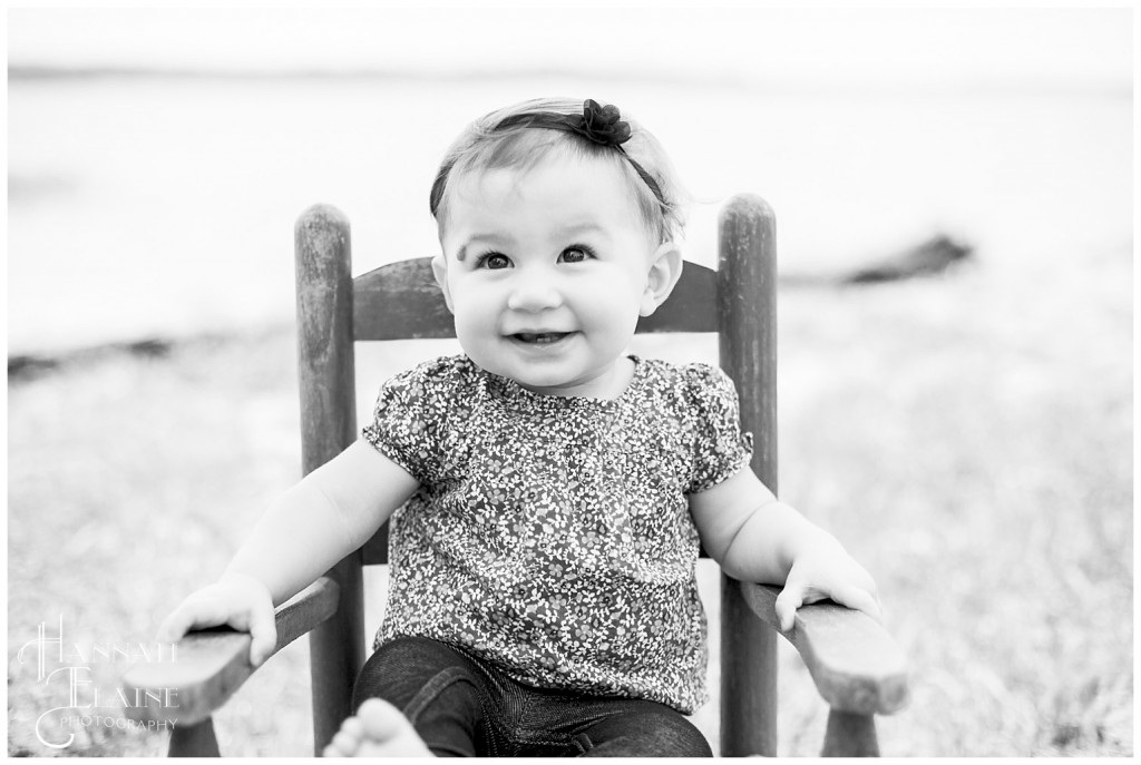 black and white image of little girl in rocking chair