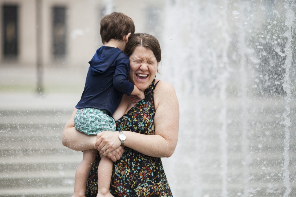 everyone gets wet when they run through the water fountain