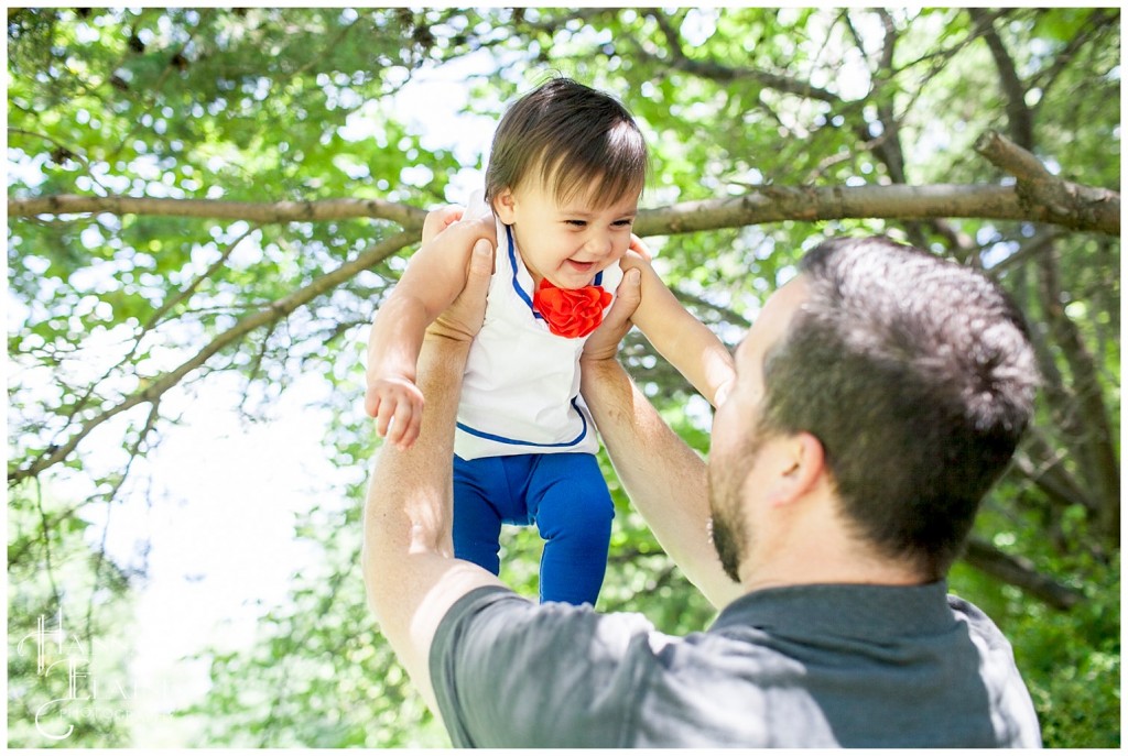 dad throws daughter up to get a smile