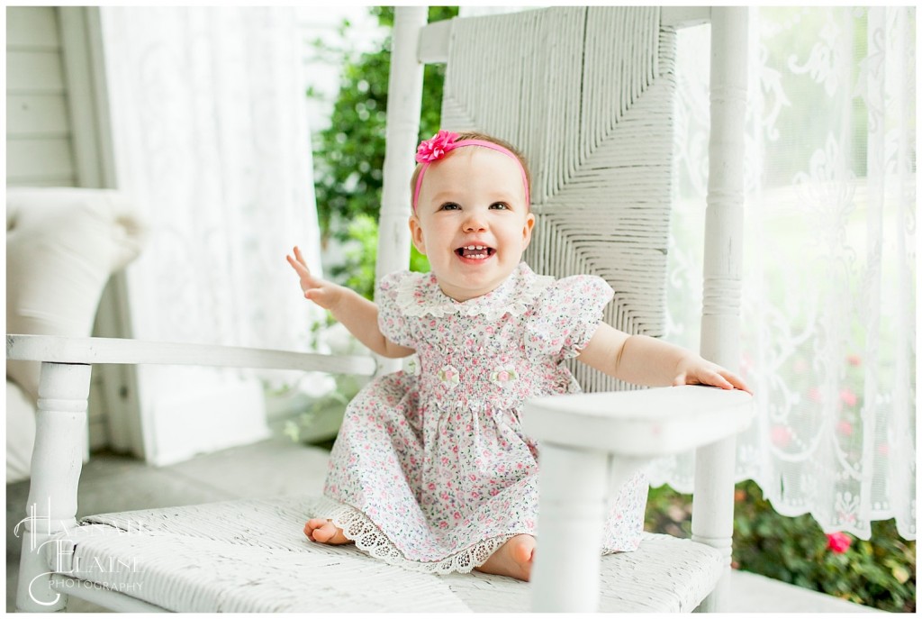 belle rocks on the white rocking chair