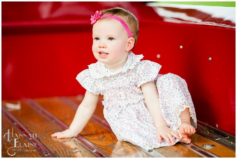 kid photos in the back of a red vintage truck