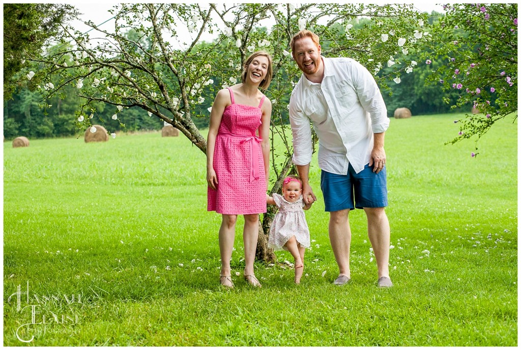 family photo time in front of the blossoming tree