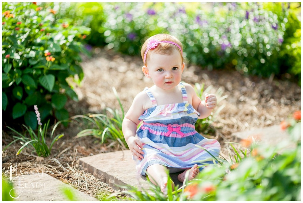 emma in the garden of summer flowers