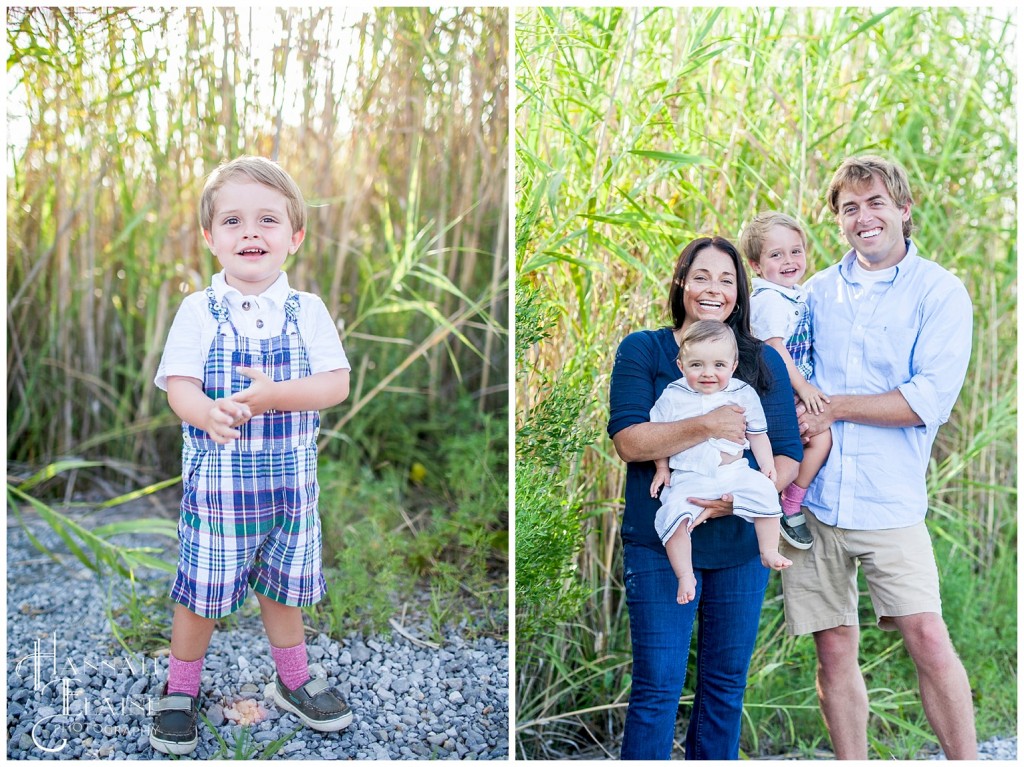 family in the sunset standing among the coastal reeds