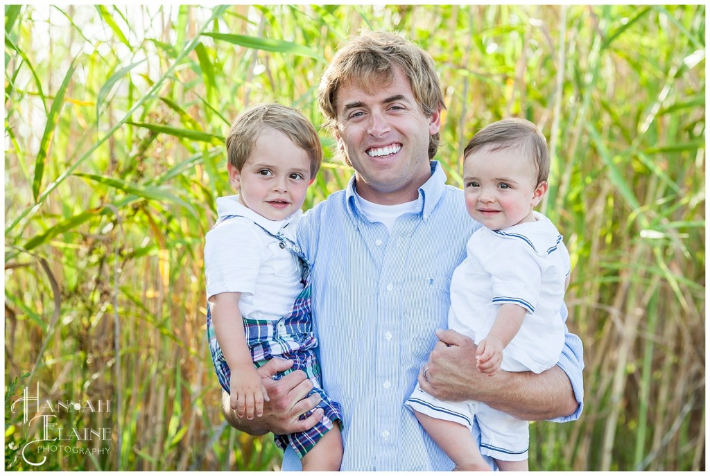 dad holds his two sons