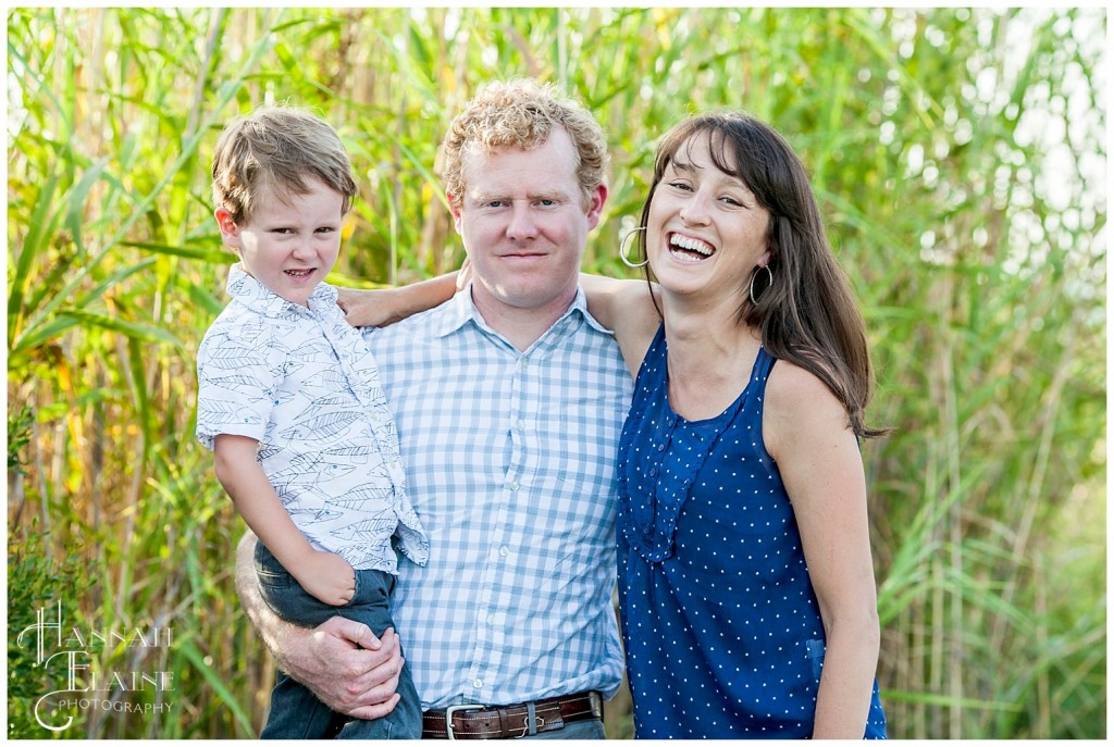 cute family of three in the tall reeds