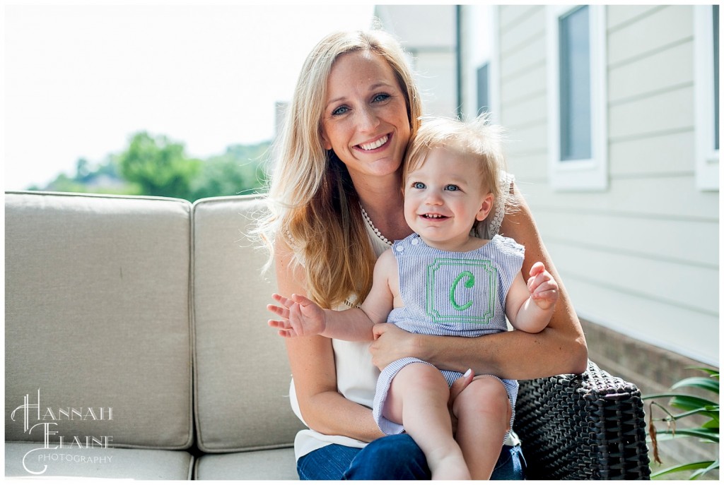 mom holds her one year old boy on his birthday