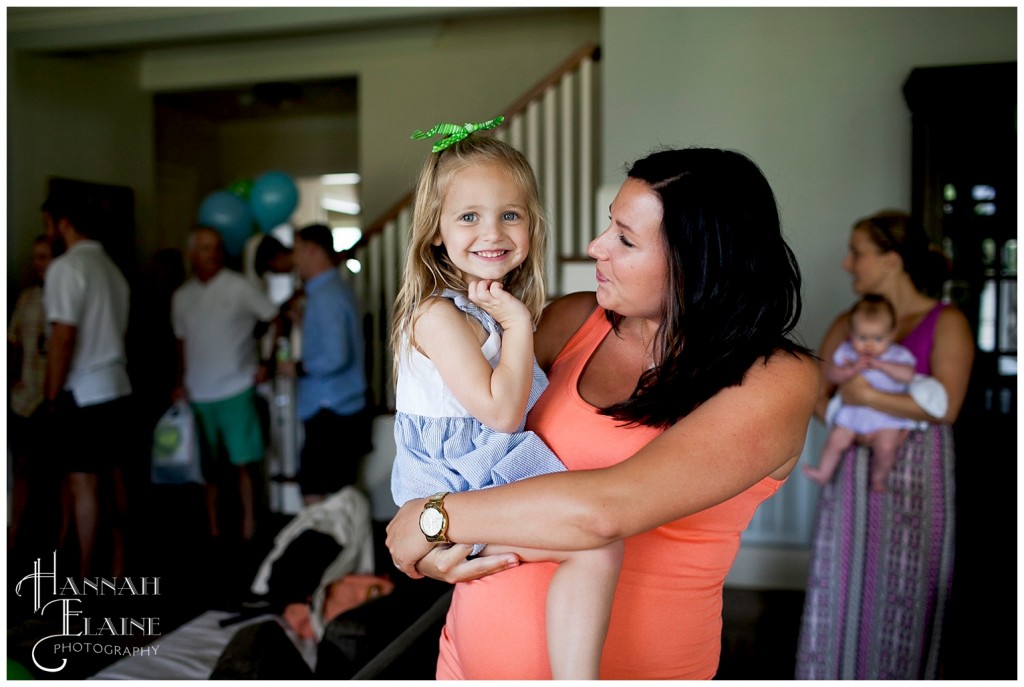 little girl is happy to see her friends at the party