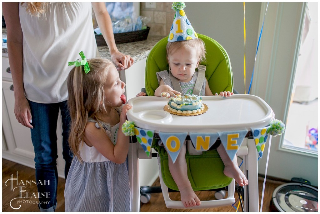 sister is jealous of little brother's smash cake