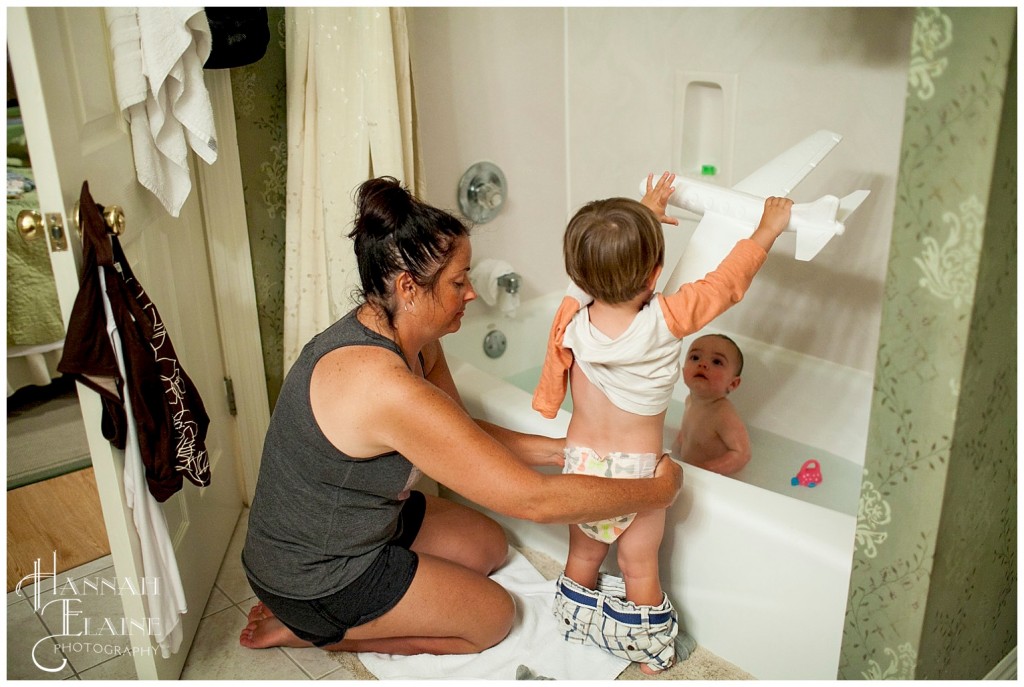 playing while trying to take a bath