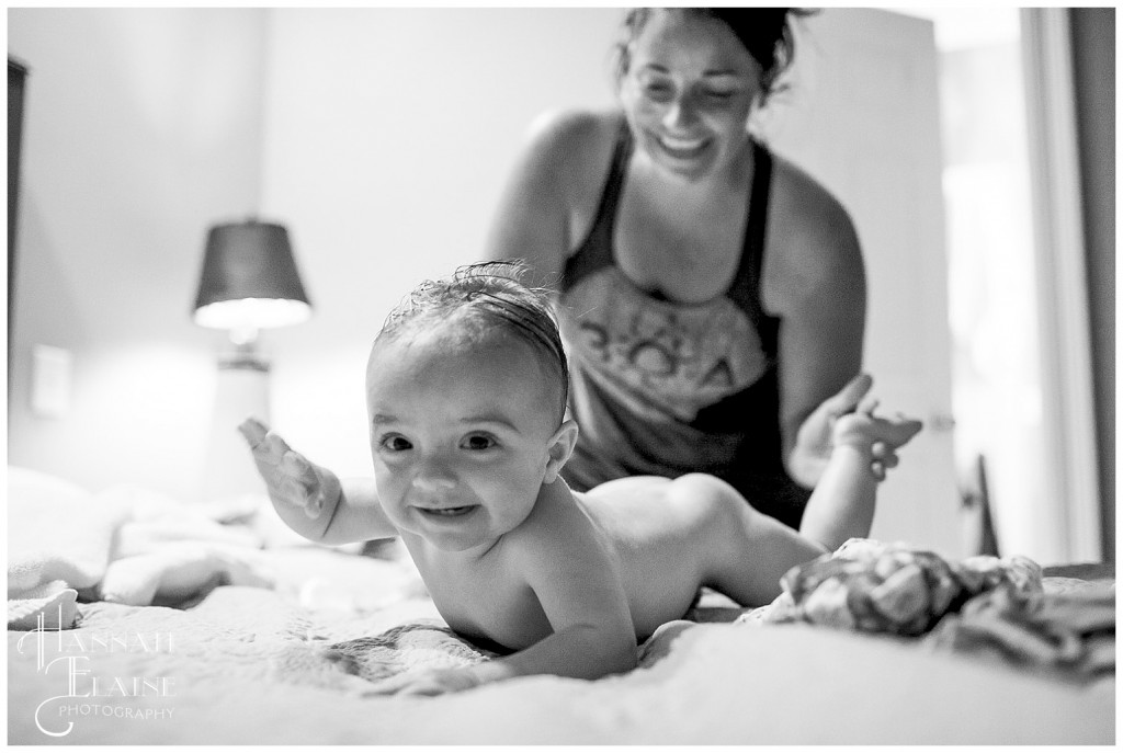 baby crawls away from mom while she's changing the diaper