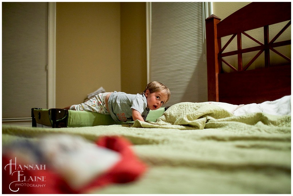 boy deftly crawls out of the pack n play