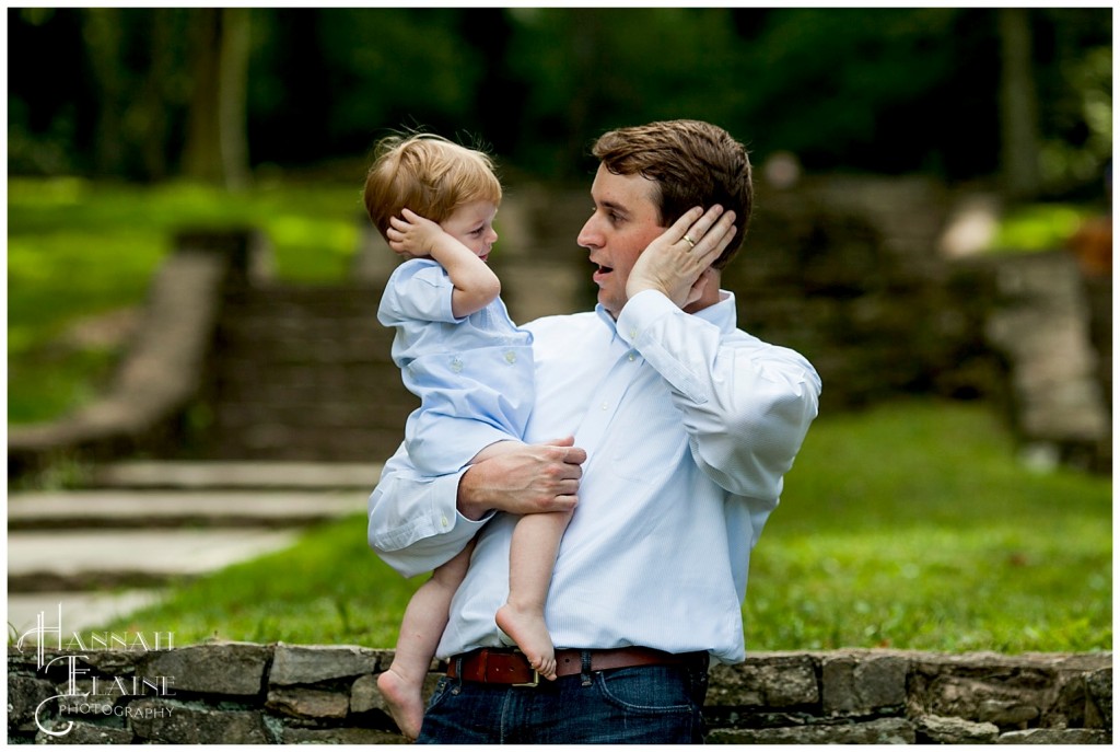 dad and son mimic being on a cell phone