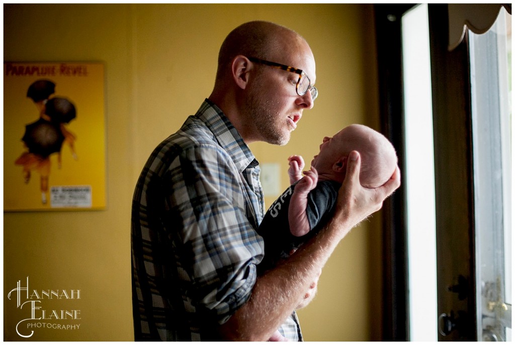 ryan holds baby wilder, newborn son