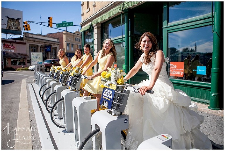 girls in yellow dresses on yellow bikes